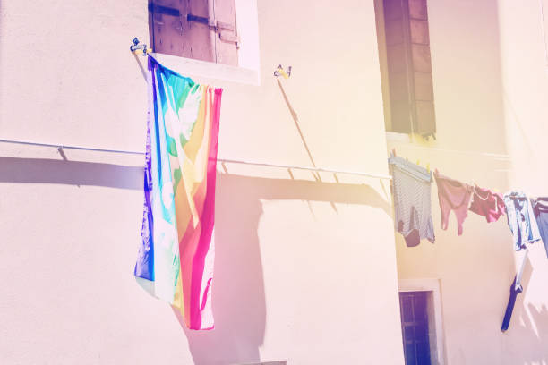 istock lgbt rainbow flag hanging on the wall 1214653046