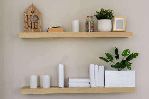 istock Stylish scandi interior with books and flower. 1214654513