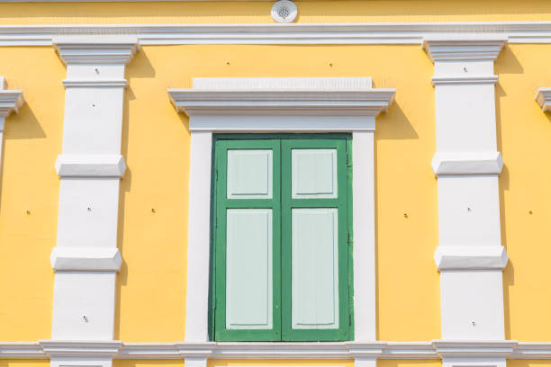 istock abstract row of the orange colored building with blue sky 1214654561
