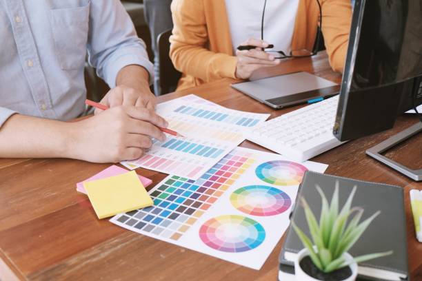istock Graphic designer working on digital tablet. artist drawing on graphic tablet and Color swatch samples. 1214654898