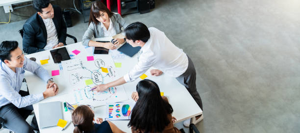 istock Happy businessman teamwork brainstorm and discussing on white table during business presentation in the office. 1214655230