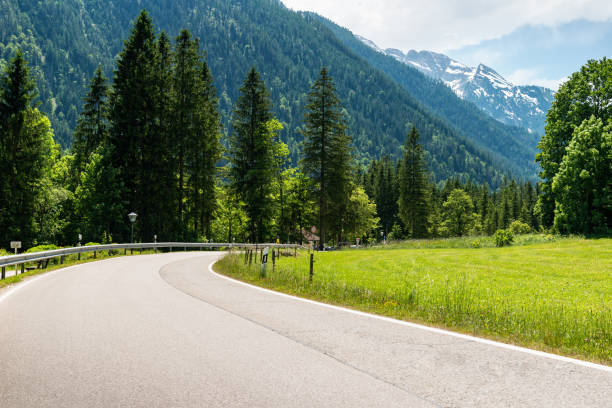 istock Countriside alpine road at summer noon 1214656424