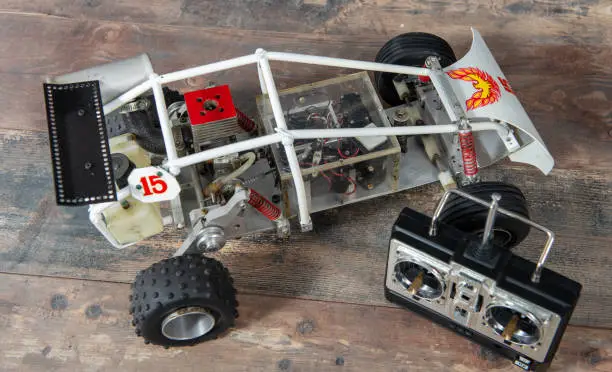 Photo of RC buggy models and a control panel.