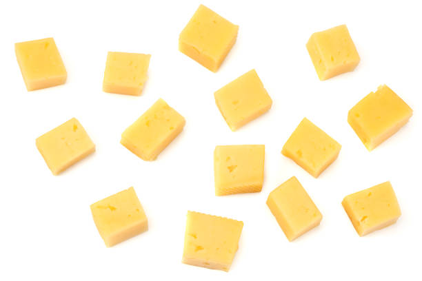 istock piece of cheese isolated on white background. macro 1214656784