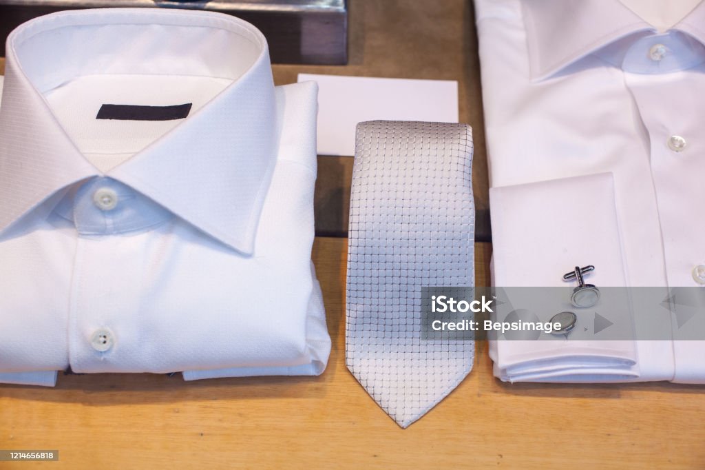 White male shirts with cuff link and necktie White male shirts with cuff link and necktie exposed Boutonniere Stock Photo
