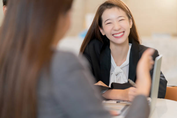 istock Interview job recruitment concept attractive asian female  answer question between meeting room human resource  job head hunter interview 1214659634
