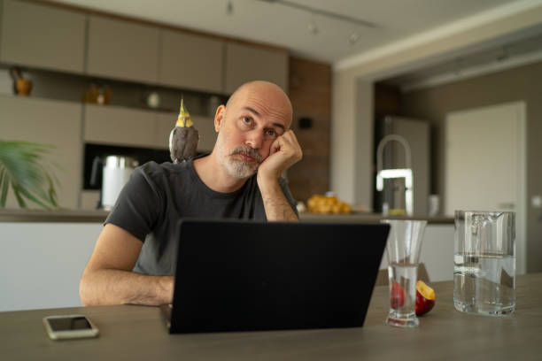 istock worried business man working from home during covd-19 quarantine 1214661009