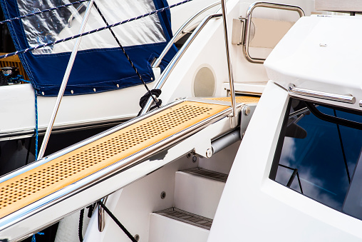 Yacht boarding ladder with rotating platform