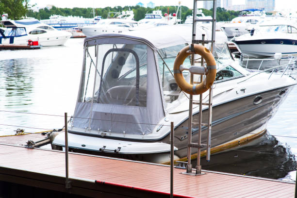 istock Small motor boat at anchor by rope in Replot pier 1214662076