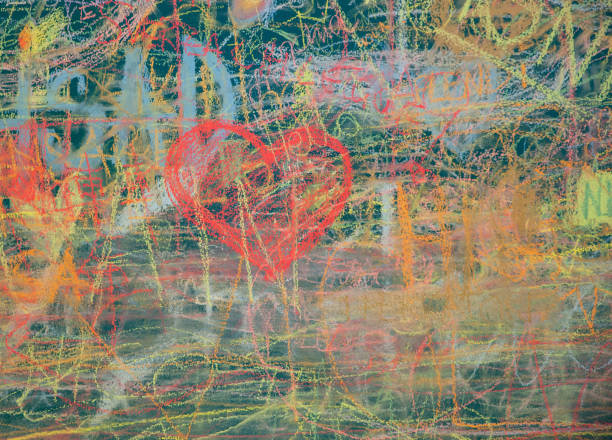 istock Blackboard with heart and many colored draws 1214663592