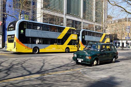 Tbilisi, Georgia - October 9, 2021: Green urban bus Anadolu Isuzu Novo Citi Life in a city street.