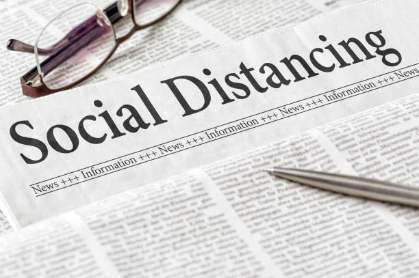 istock A newspaper with the headline Social Distancing 1214665107