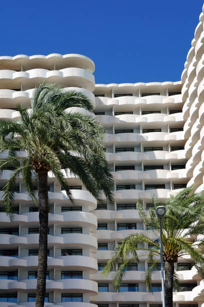 istock Hotel building and palm trees 1214666302