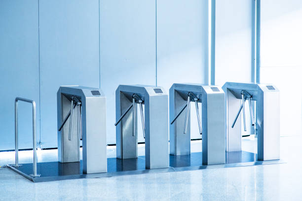No passage, concept. Turnstiles are closed, chrome turnstiles with a red prohibiting signal. stock photo
