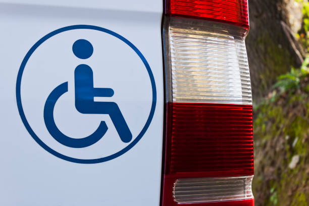 istock Accessible vehicle sign on white van 1214669833