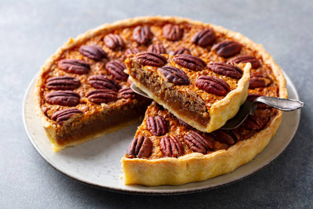 istock Pecan nut pie, tart on a plate. Grey background. Close up. 1214671771