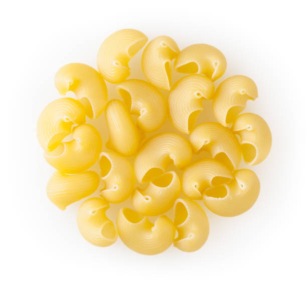 istock Uncooked pipe rigate pasta isolated on white background with clipping path 1214674440