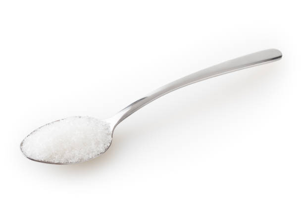 Teaspoon of sugar isolated on white background with clipping path