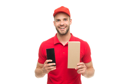 Delivering your purchase. Happy smiling man with post package white background. Gifts for holiday. Courier service delivery. Salesman courier career. Courier delivery service. Postman delivery worker.