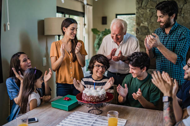 istock Boy celebrating birthday with family 1214675290