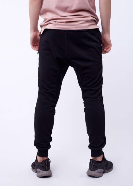 istock man in jeans, denim pants close up on white background, black jeans. 1214675315