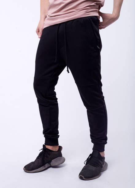 istock man in jeans, denim pants close up on white background, black jeans. 1214675330