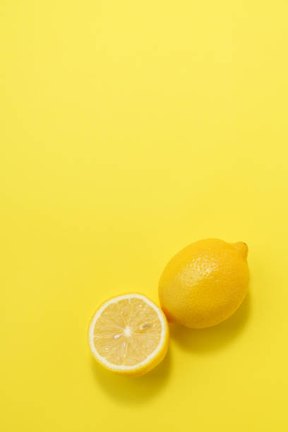 istock Sliced lemon fruit isolated on color background 1214679445