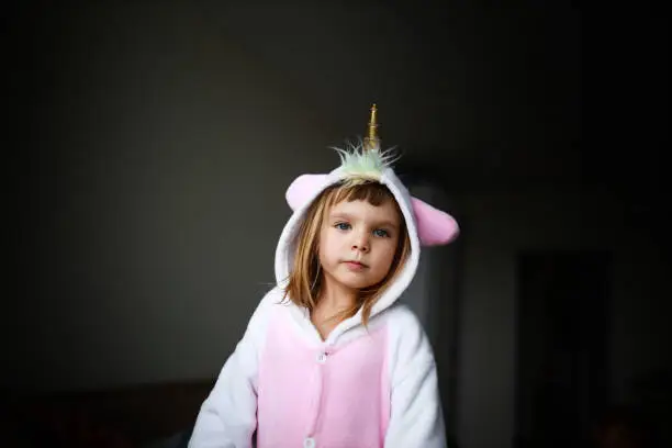 Photo of portrait of a girl in unicorn costume