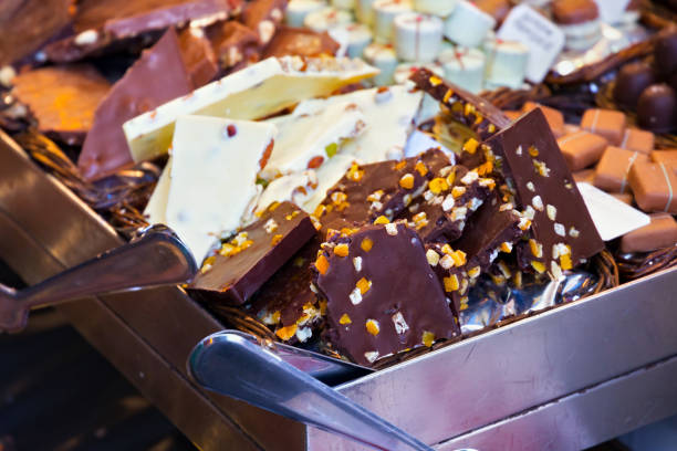 istock Dark and white chocolate and other sweets on the market. 1214681686