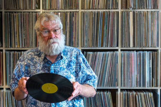 istock Record collector in front of his collection 1214683956