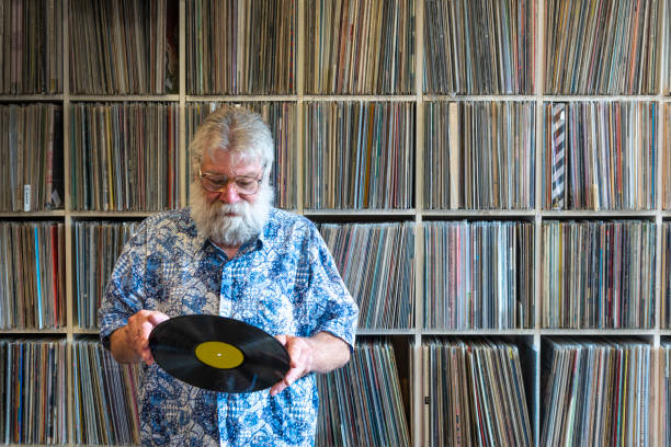 istock Record collector in front of his collection 1214684016