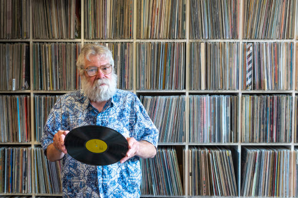 istock Record collector in front of his collection 1214684047