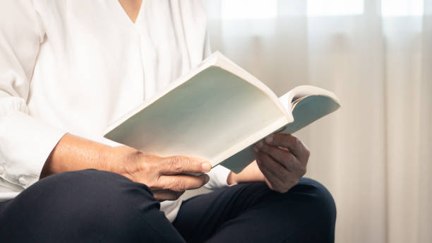 istock Covid-19 quarantine activity for senior woman read a book stay home to avoid risk 1214684913