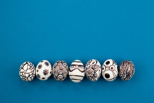 istock Easter eggs are painted black and white, abstraction, laid out in a row 1214686973