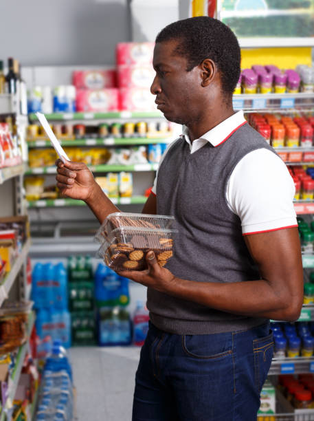 istock African man shopping with list 1214690631
