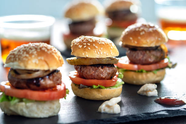 istock Mini beef hamburgers on bar counter. 1214690672