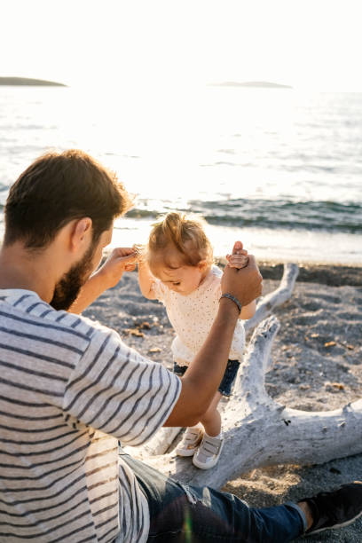 istock Happy father with his dsughters 1214690714