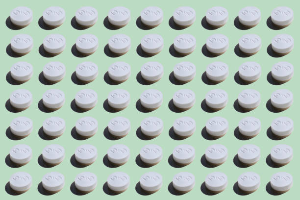 istock Yellow Pills on green pop art Background 1214691370