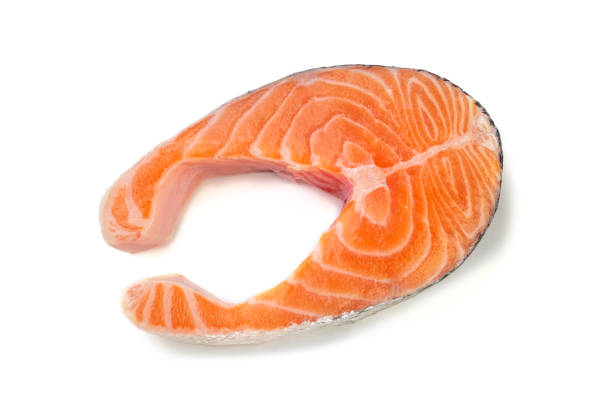 istock Salmon steak close-up on white background 1214692060