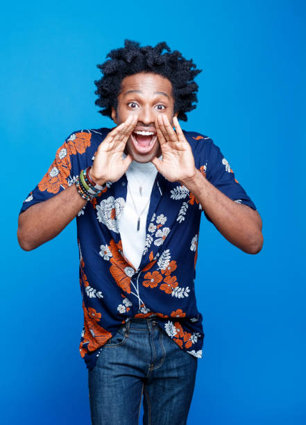 istock Man in hawaiian shirt shouting at camera 1214693769