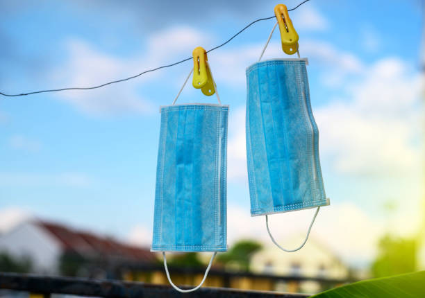 Hanging surgical mask under hot sun