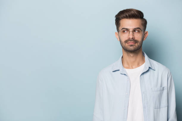istock Pensive man in glasses look at blank copy space 1214694497