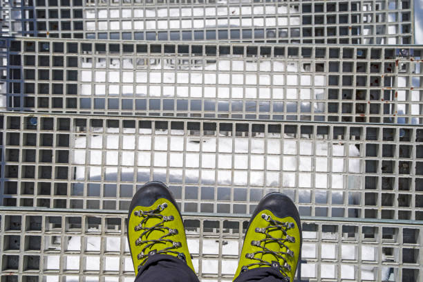 Trekker boots on stairs, winter boots on winter mountain