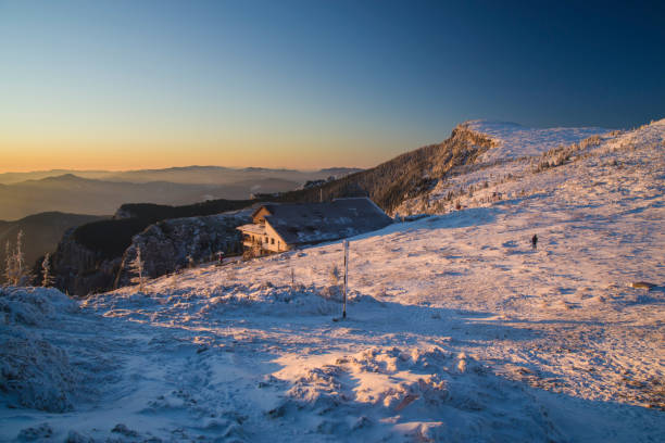 istock Winter scene at mountain chalet 1214695329
