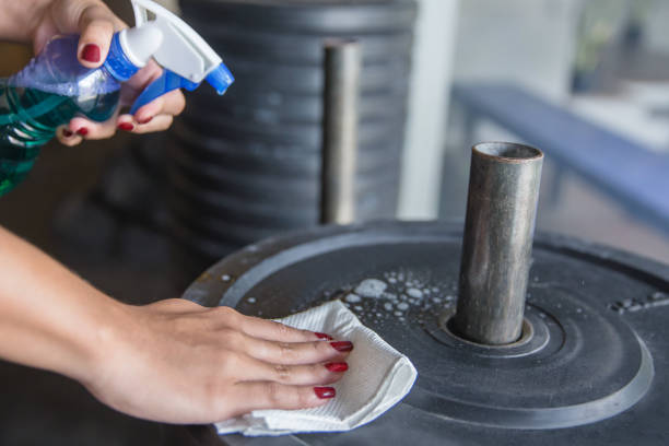 istock Cleaning weight plates before and after used 1214695637