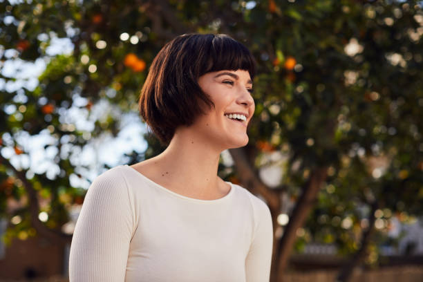 istock Sporty young woman laughing while standing in her backyard 1214695946