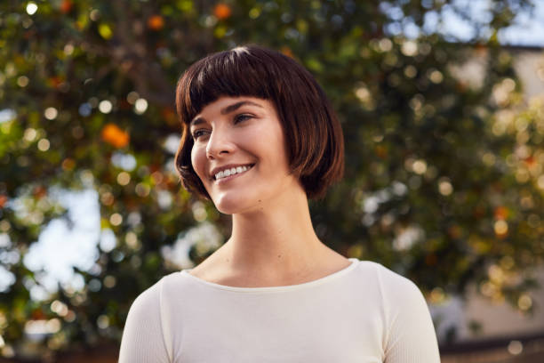 istock Smiling young woman standing in her yard after exercising 1214696234