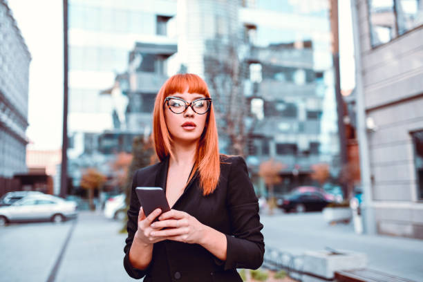 istock Elegant Female Looking For Specific Location On Smartphone GPS 1214697536