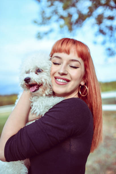 istock Female Embracing Her Cute Dog On Ranch 1214697845