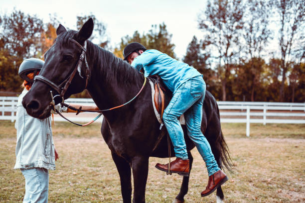 istock Male Climbing His Horse For A Ride 1214697926